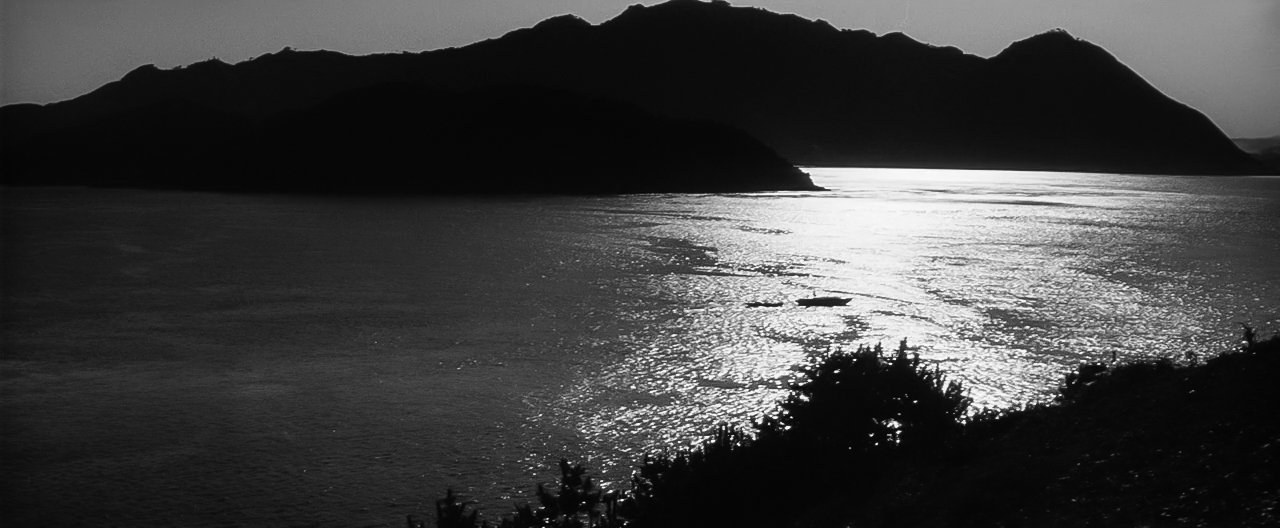 Sagishima silhouetted across the inland sea, from Kaneto Shindo's *The Naked Island* (1960) / 新藤兼人『裸の島』(1960)より、瀬戸内に浮かぶ佐木島